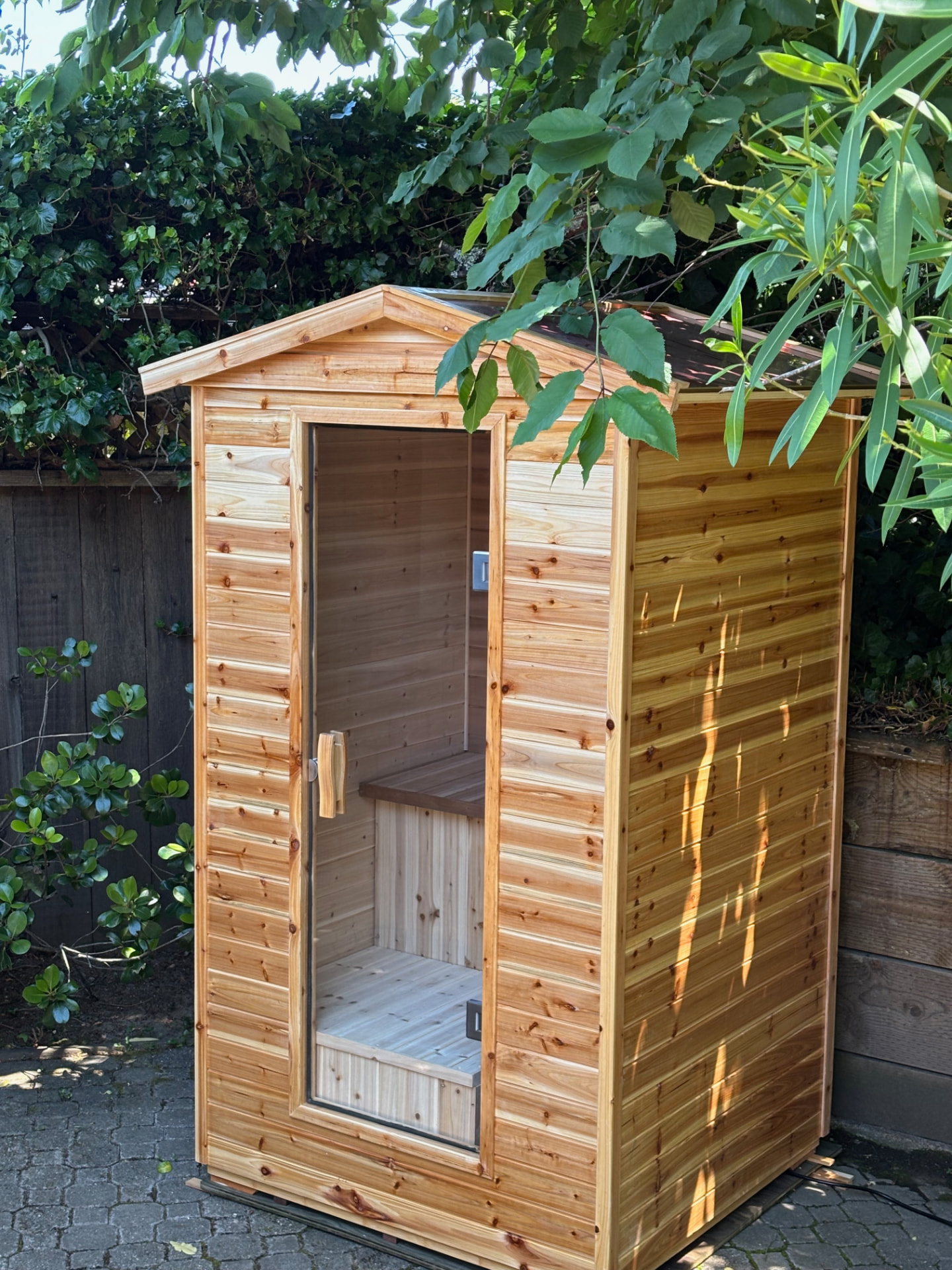 Outdoor cedar traditional sauna rental installed in a San Francisco backyard patio